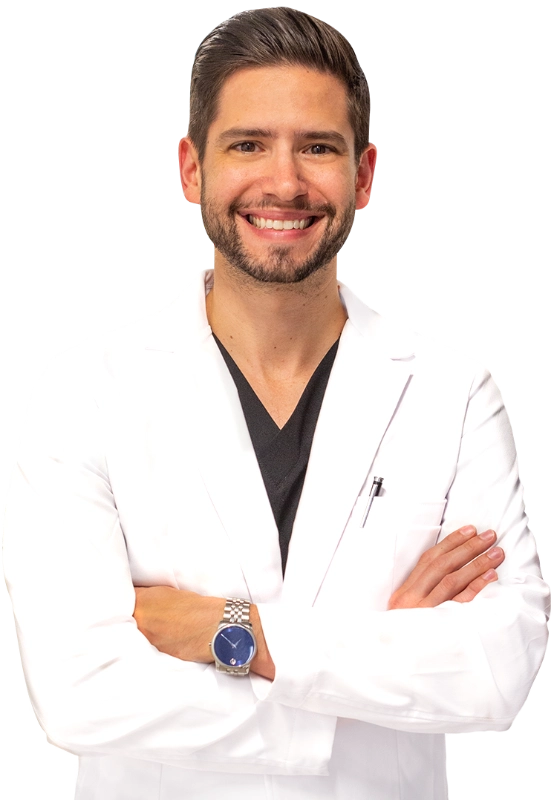 Professional headshot of Dr. Bonnie McKinley wearing a white lab coat, smiling at the camera against a black background. This is a standard medical professional portrait used for clinic or practice identification.