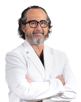 VTC_DrLech_CutOut_Main_optimized Professional portrait of Dr. Walter Lech, a vein specialist, wearing a white lab coat and glasses, posed against a black background with arms crossed. This formal clinical headshot represents a healthcare provider specializing in vein treatment services.