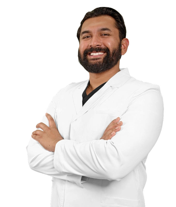 Professional headshot of Dr. Bonnie McKinley wearing a white lab coat, smiling at the camera against a black background. This is a standard medical professional portrait used for clinic or practice identification.